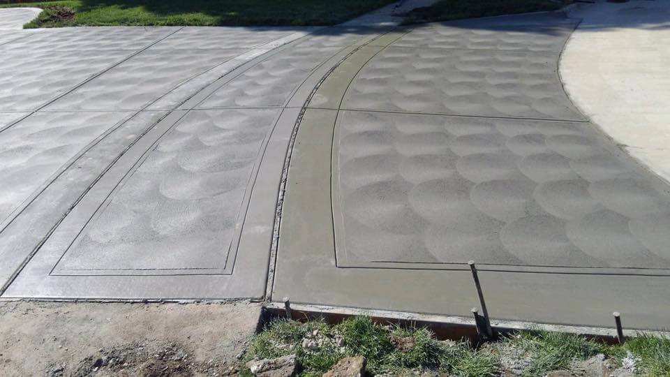 Four concrete slabs in the process of drying at a residential property.